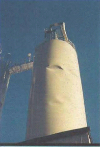 Denting in welded steel silo caused by eccentric withdrawal